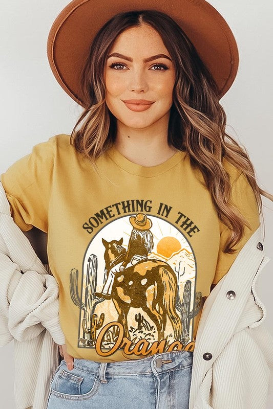 Something in the Orange Cowgirl Graphic Tee